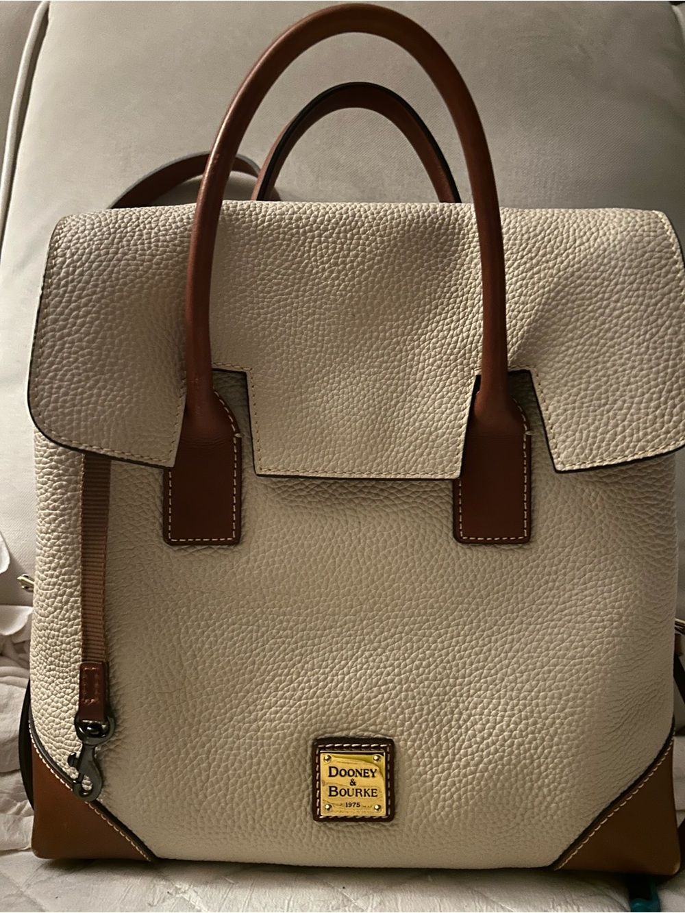 Dooney & Bourke Cream Pebbled Leather Backpack with Brown Trim